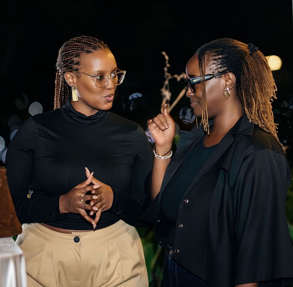 Two guests deep in conversation at Event One